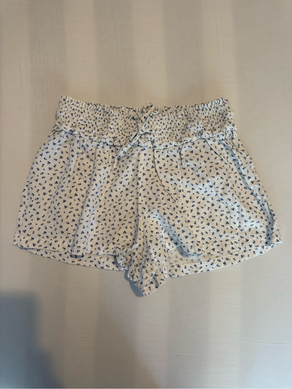 Abound White Floral Smocked High-Waist Shorts with Blue Print